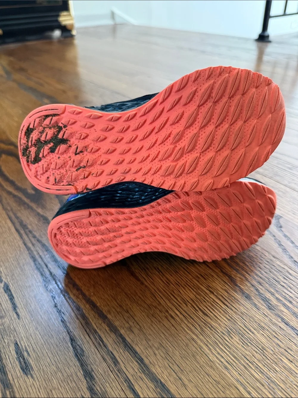 E New Balance Kids 13 Black Sneakers with Blue N Logo and Coral Accents